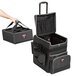 A black and grey Rubbermaid luggage bag with wheels and a handle.