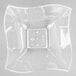 A clear square shaped bowl.