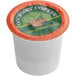 A white Caffe de Aroma single serve cup of decaf coffee with a green and orange label.