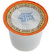 A Caffe de Aroma decaf French vanilla coffee single serve cup with white and orange packaging.