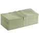 A stack of Choice Sage green 2-ply beverage napkins.