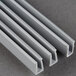 Three gray plastic strips with a metal profile.