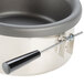 A stainless steel pan with a black handle for a Paragon popcorn popper.