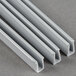 Grey plastic strips with white metal profiles on the ends.