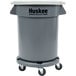 A grey Continental Huskee trash container with white lid and wheels.