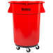 A red plastic Continental Huskee trash container with wheels and a lid.