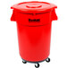 A red plastic trash can with wheels.