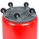 A red cylindrical Continental Huskee trash can with wheels.