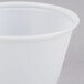 A translucent plastic Solo portion cup on a white surface.