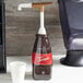 Torani 1 oz. Flavoring Pelican Sauce Pump for 64fl oz. Plastic Bottles Main Thumbnail 4