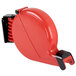 A red plastic Take a Number dispenser bracket with black handles.
