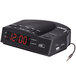 A black Conair alarm clock radio with a digital display and red numbers.