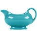 A turquoise ceramic sauce boat with a handle.