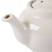A Hall China ivory Boston teapot with a lid.