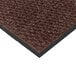 A brown Cactus Mat carpet mat with black trim.