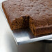 A large square chocolate fudge brownie cake on a metal tray.