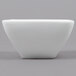 A white square Arcoroc bowl.