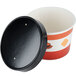 A black and orange Choice paper soup container with a black vented lid.
