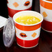 A close-up of a Choice paper soup cup filled with noodles.