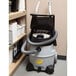 A ProTeam ProGuard 16 MD wet/dry vacuum cleaner in a room.