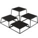 A Tablecraft black metal square riser set with black square pads.