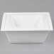 A white square container with a square lid.