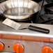 A Mercer Culinary square edge turner on a counter.