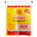 A yellow and white bag of Carnival King All-In-One Popcorn Kit for 4 oz. Popper.