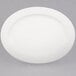 A CAC Garden State bone white porcelain platter with an oval shape and white rim.