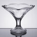 A clear glass bowl with a scalloped edge.