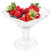 A Libbey glass sundae dish filled with berries and nuts.
