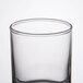 A clear glass Libbey votive shot glass.