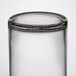 A Libbey clear glass votive shot glass with a lid.