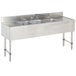 A stainless steel Advance Tabco bar sink with three compartments and two 12" drainboards.