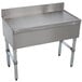 A stainless steel free-standing drainboard with a metal surface.