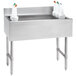 A stainless steel Advance Tabco underbar ice bin with white containers on top.