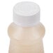 A white plastic bottle of Alto-Shaam Cleaner with a white cap.