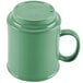 A close-up of a rainforest green GET Diamond Mardi Gras mug with a handle.