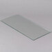 An Avantco glass panel with clear edges on a white surface.