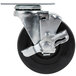 A 4 inch metal Swivel Plate Caster with a black wheel and black handle.