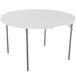A white round Lifetime folding table with metal legs.