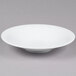 A CAC Super Bright White Coupe Porcelain Bowl on a white background.