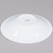 A CAC Super Bright White porcelain bowl with a round bottom.