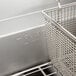 A Pitco 45C+S natural gas fryer with a basket in it.