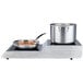A Waring double countertop induction range with a pot and pan on it.