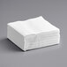 A stack of Choice White Linen-Feel paper napkins.