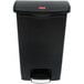 A black Rubbermaid Slim Jim step-on trash can with a lid.