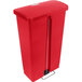 A red plastic Rubbermaid Slim Jim rectangular trash can with a lid.
