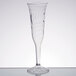 A clear plastic champagne flute with a curved design.