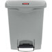 A Rubbermaid Slim Jim grey rectangular front step-on trash can with a lid.